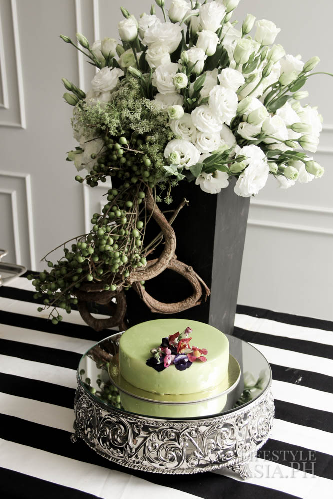 The La Matcha mirror cake by Rebecca Disini is a centerpiece of Maureen's dinner