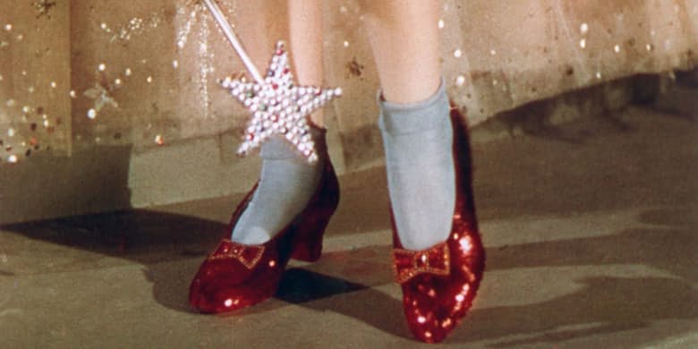 THE WIZARD OF OZ Judy Garland's Dorothy Costume and Ruby Slippers, designed by costume designer Gilbert Adrian