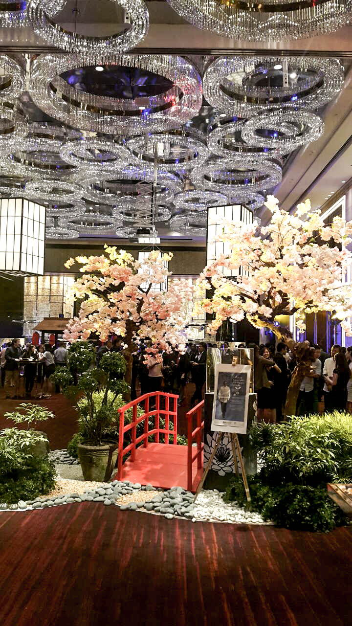A traditional Japanese garden with a red bridge and cherry blossom trees was set up in the midsection of the Grand Ballroom.