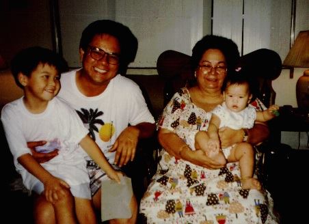 Pat Masigan posing with son Francis John Masigan and her two grandchildren, Miguel and Samantha. 