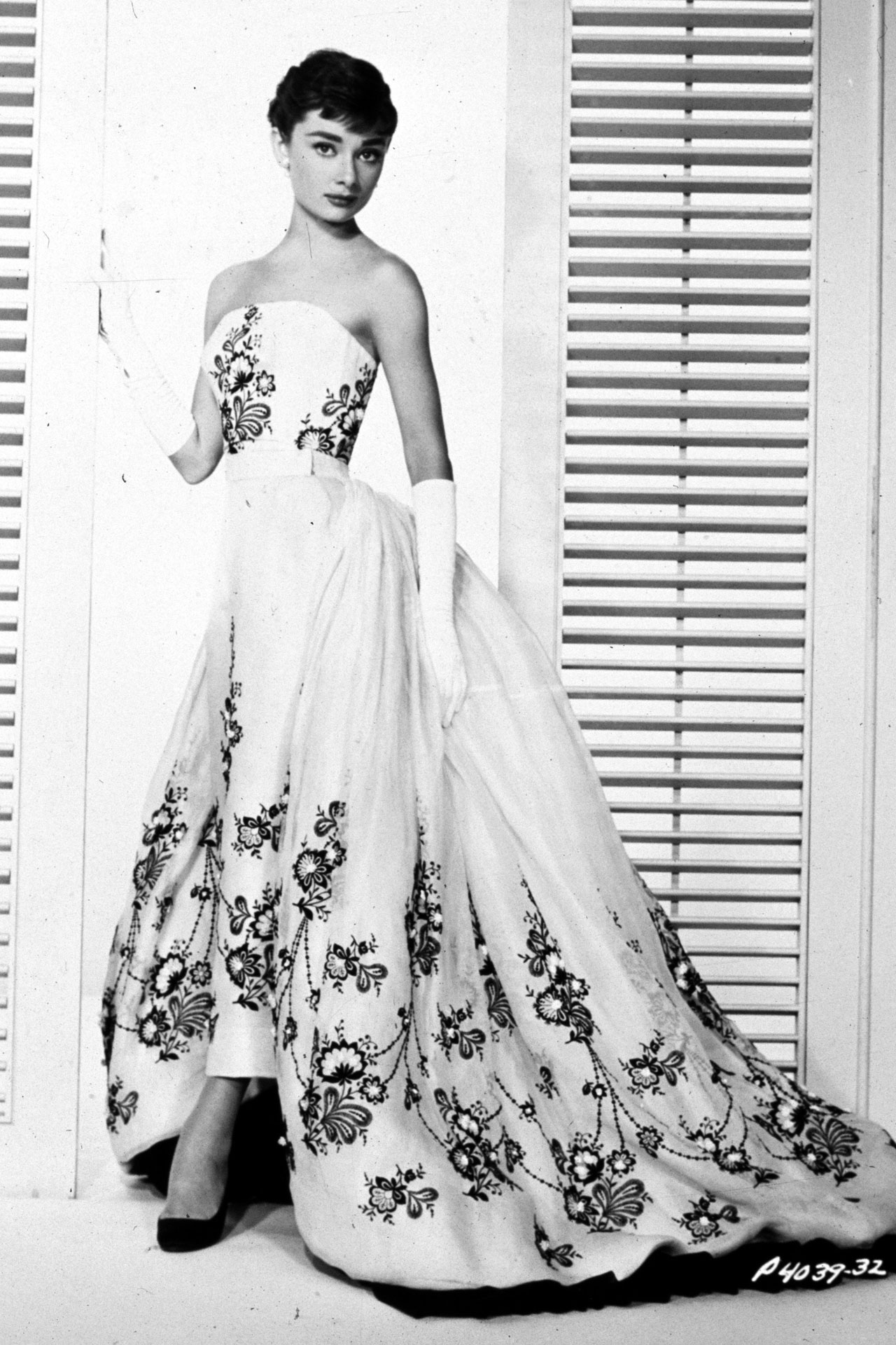The white ball gown with black flower embroidery designed by Givenchy appeared in 1954's Sabrina