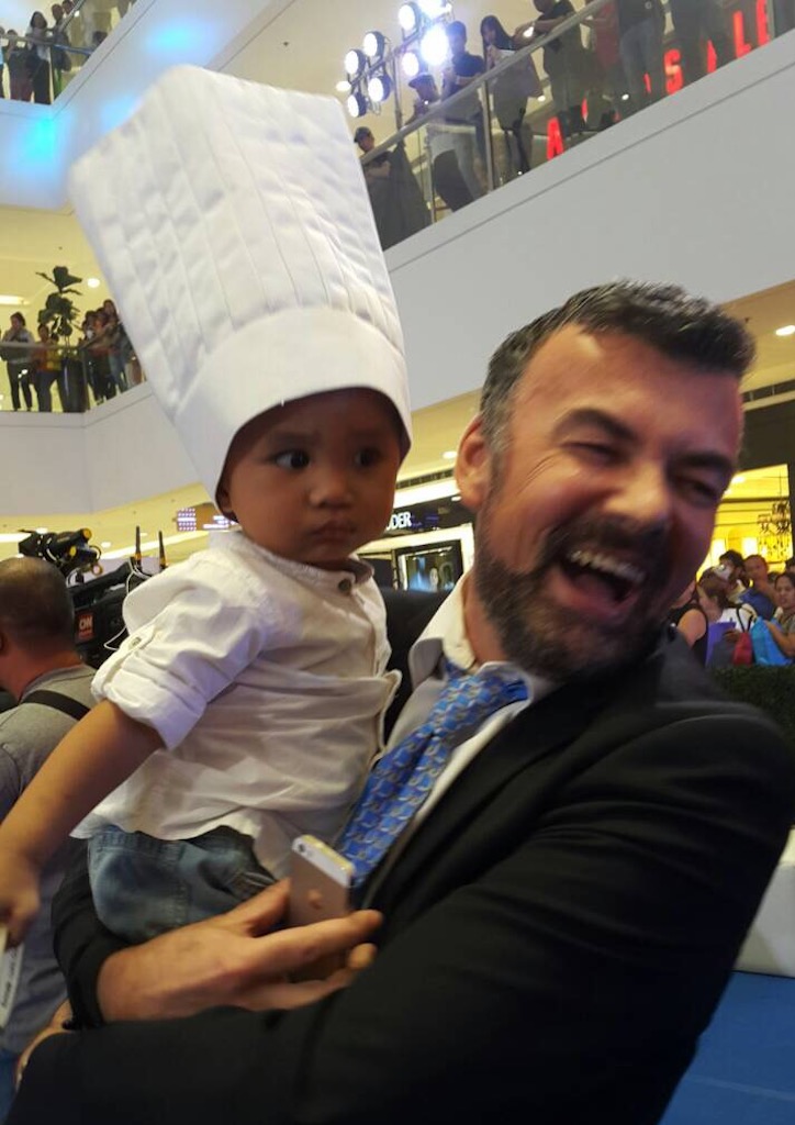 Chef Xavier Btesh with a boy who wants to become a chef