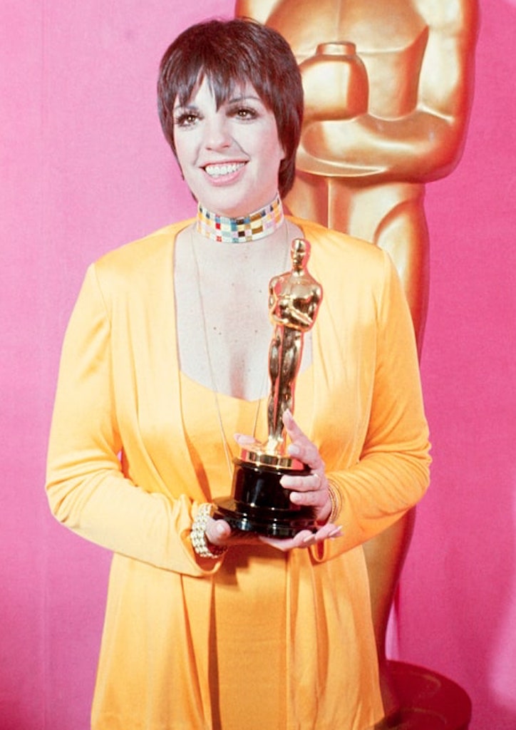 Minnelli accepting her Oscar for Cabaret (1972) in a gown by Halston