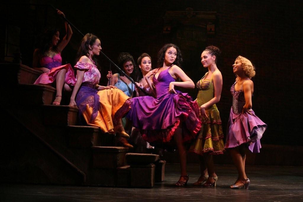 Karen Olivo (center, purple dress) won a Tony for her performance in West Side Story. She will play Satine in the upcoming Moulin Rouge musical (Photography courtesy of Madison.com)
