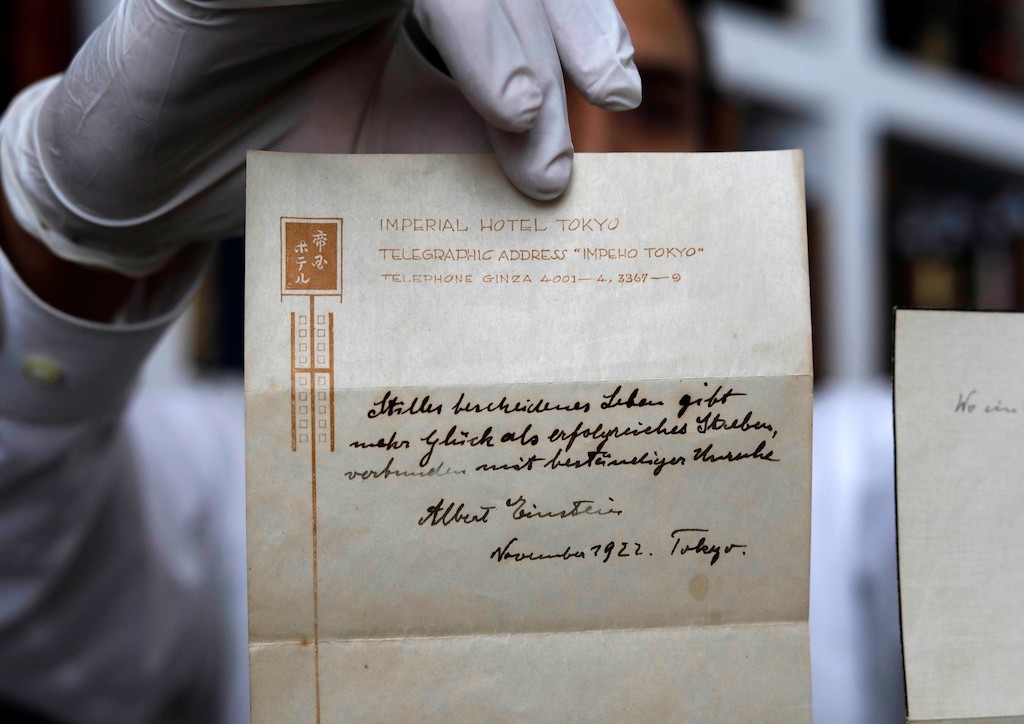 The note by Albert Einstein was written in 1922 in a Tokyo hotel stationary (Photograph courtesy of TheHeatMag.com) 