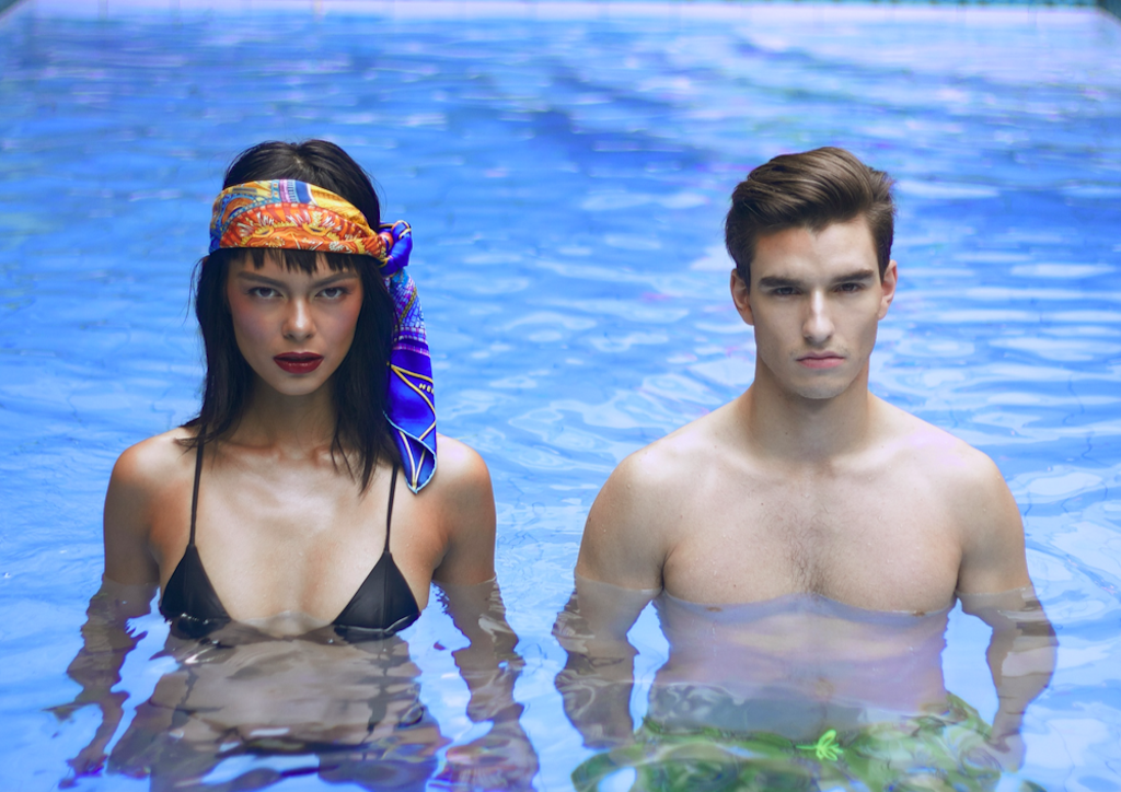 Use an Hermès scarf as a turban to look good even when in the water