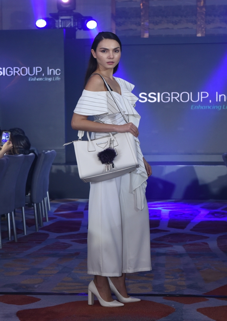 A runway model with a Prada bag from SSI