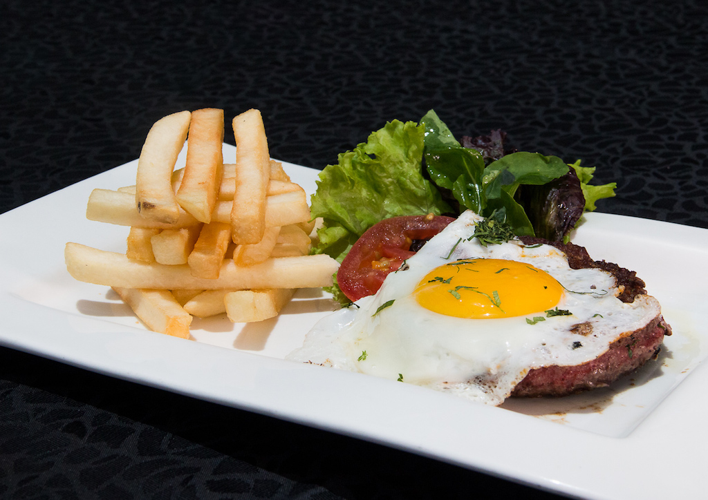 Steak á Cheval - A beef steak topped with a fried egg.