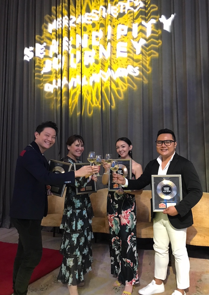 The Aivee Group team celebrates with a toast during the Bangkok ceremony