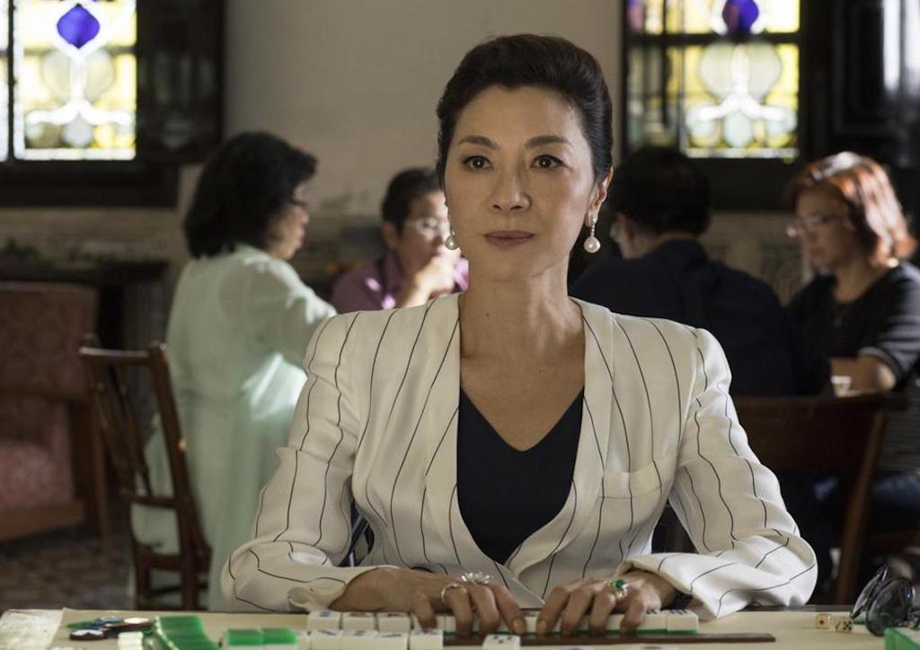 Michelle Yeoh as Eleanor Young in an Armani pinstripped suit