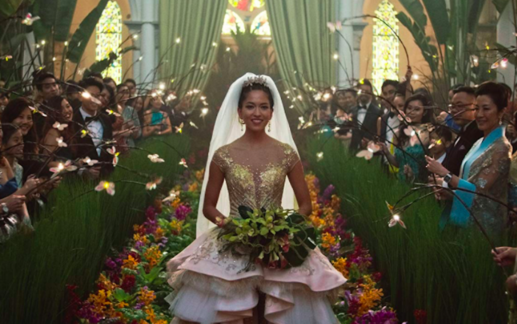 Sonoya Mizuno as Araminta Lee in a custom made gold and white-sequin wedding dress by Mary Vogt and Carven Ong