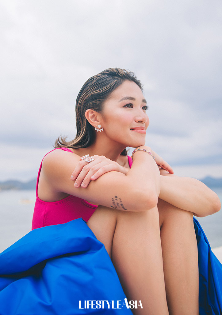 Taking a breath of fresh air while wearing Royal blue skirt by Neric Beltran, diamond earrings by Suki Jewelry, diamond rings and multi-colored tennis bracelet by Mei Diamond Jewelry.