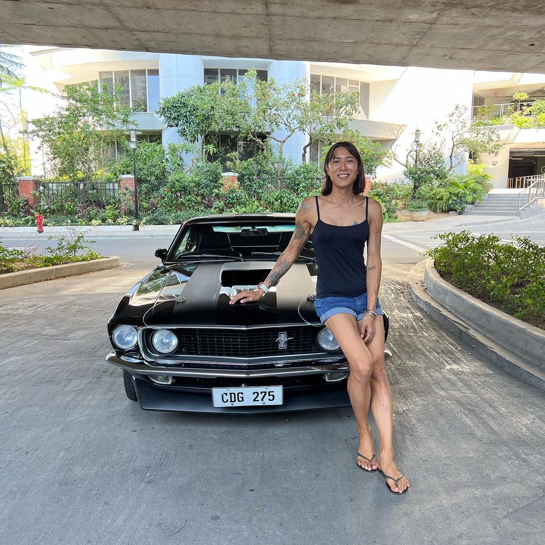 Angie Mead King posing with her car
