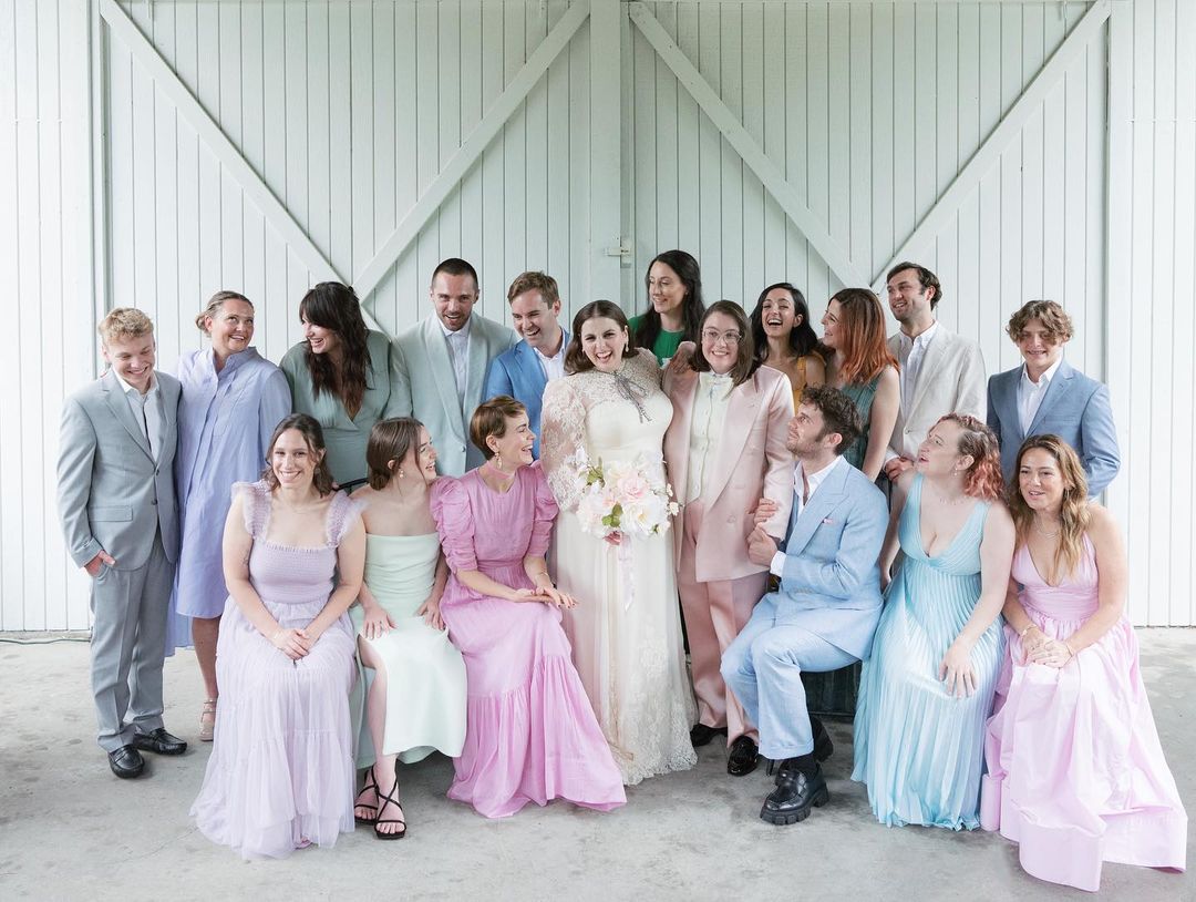 Beanie Feldstein and Bonnie-Chance Roberts surrounded by friends and family.