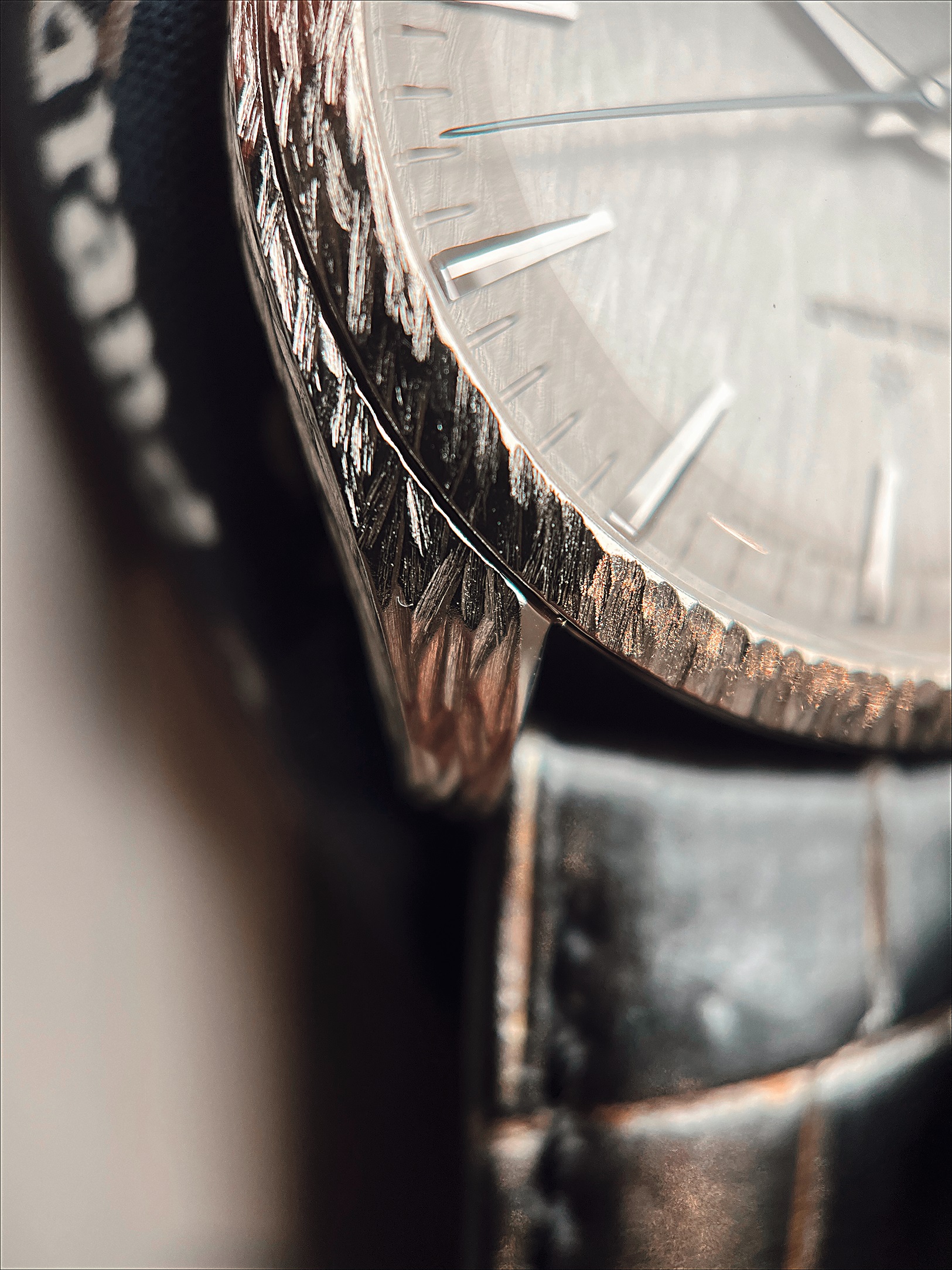 A closer look at the hand engraved Grand Seiko shows the work done separately on the case, bezel, and dial that all must flow properly together when assembled.