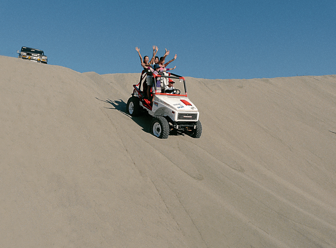 Sandboarding across the dunes of Ilocos Norte is a must-try activity for thrill-seekers.