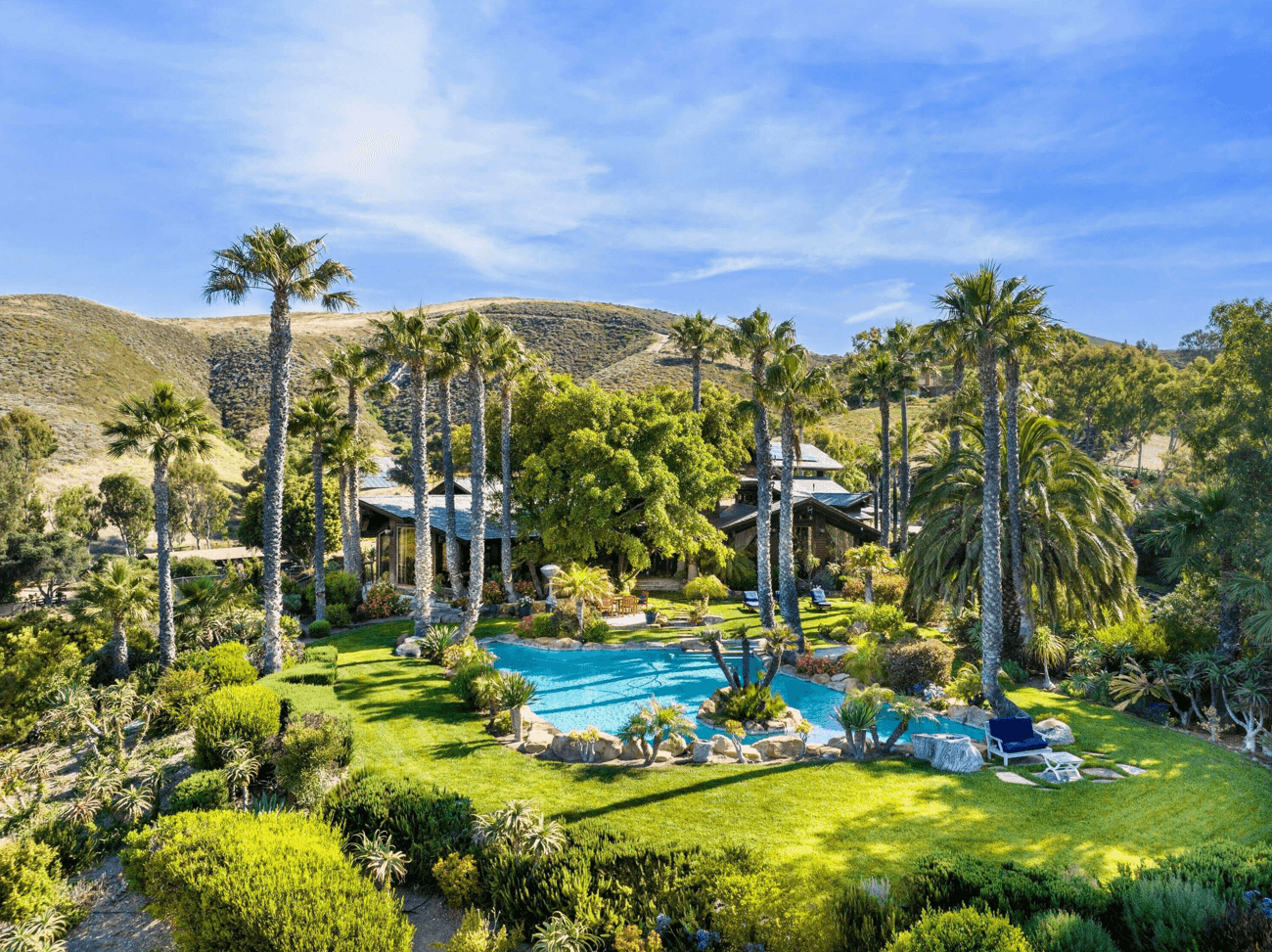 A view of the Santa Barbara home with a lagoon-style pool