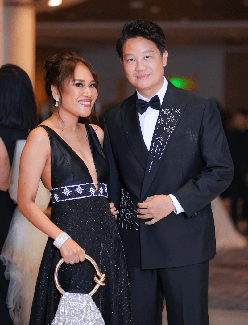 Couple Dr. Aivee and Z Teo, both wearing Mark Bumgarner