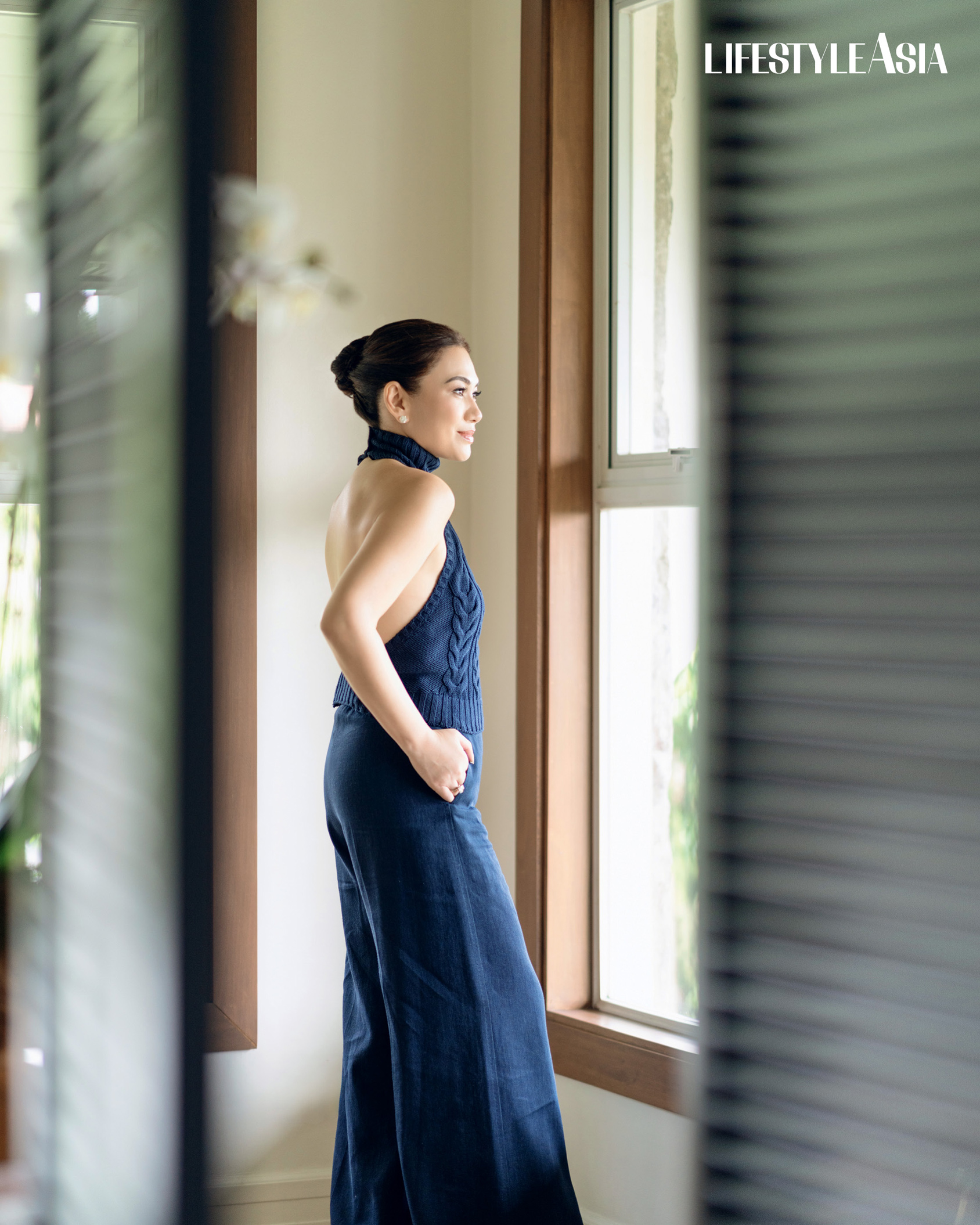 Navy blue cable knit halter top and linen wide leg trousers, MAX MARA; Diamond stud earrings, JMA JEWELRY.