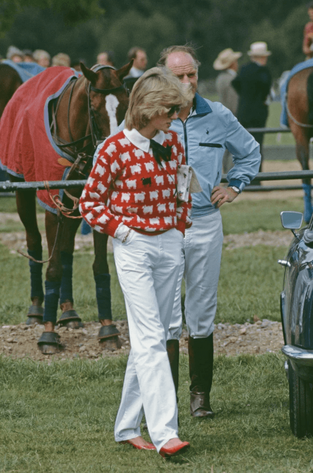 Diana wearing a second version of the black sheep sweater during another polo match