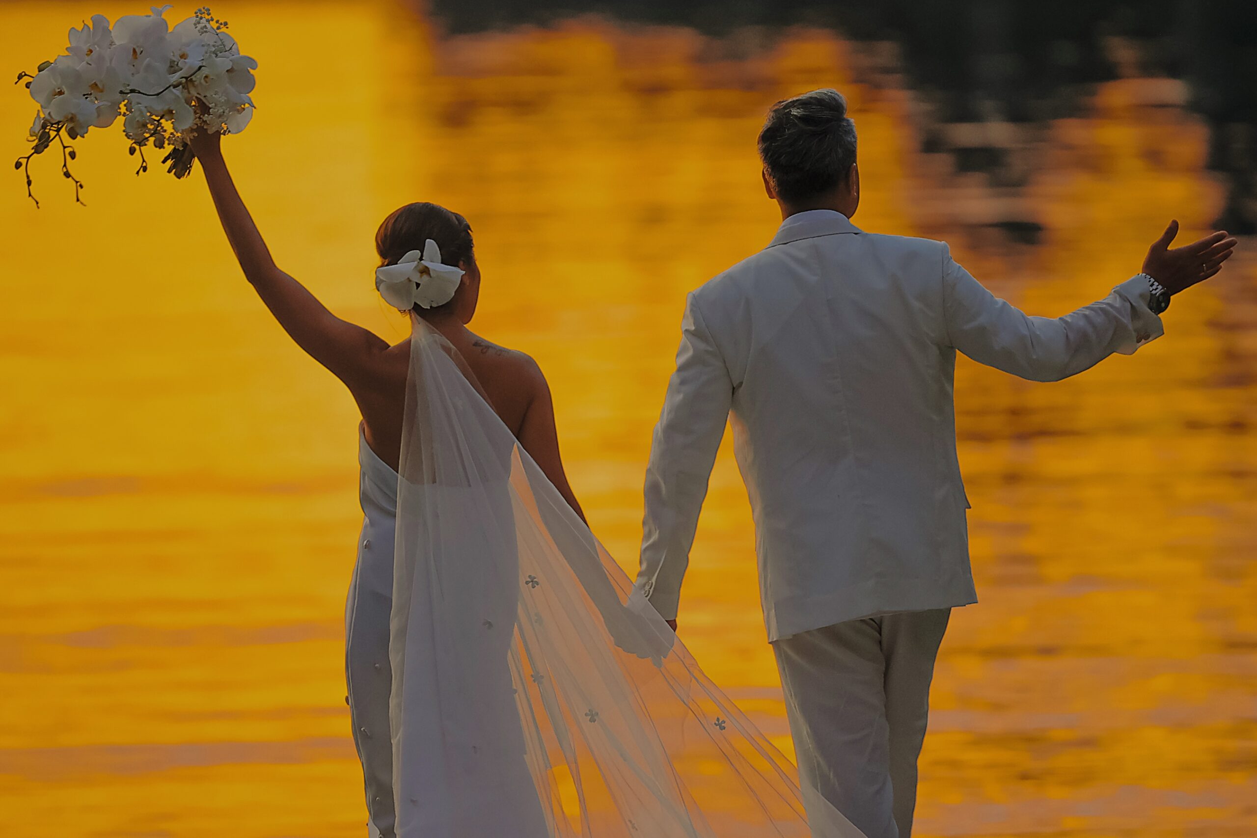 A magical sunset greets the newlyweds on their special day