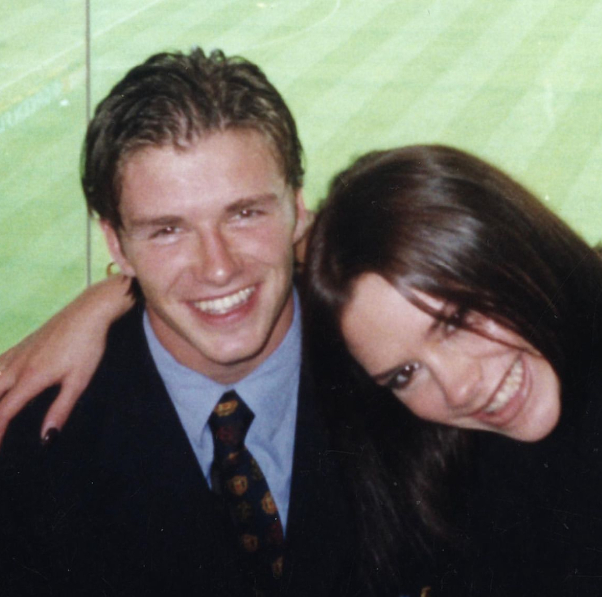 The couple smiling at the camera, this is one of the photos used for their Netflix documentary, "Beckham."