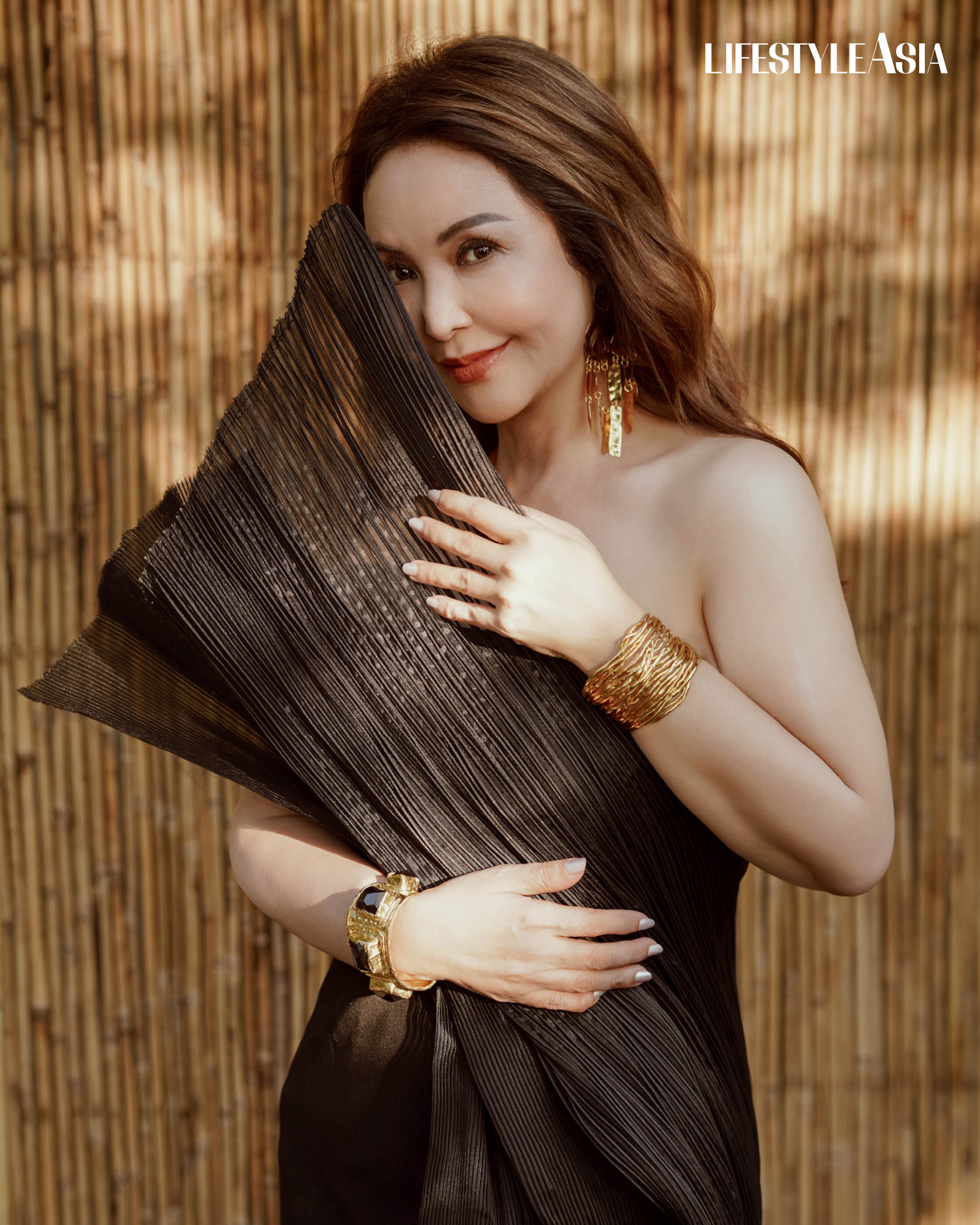 Black Marlin Dress, RAJO LAUREL; Gold earrings and cuffs, ARNEL PAPA.