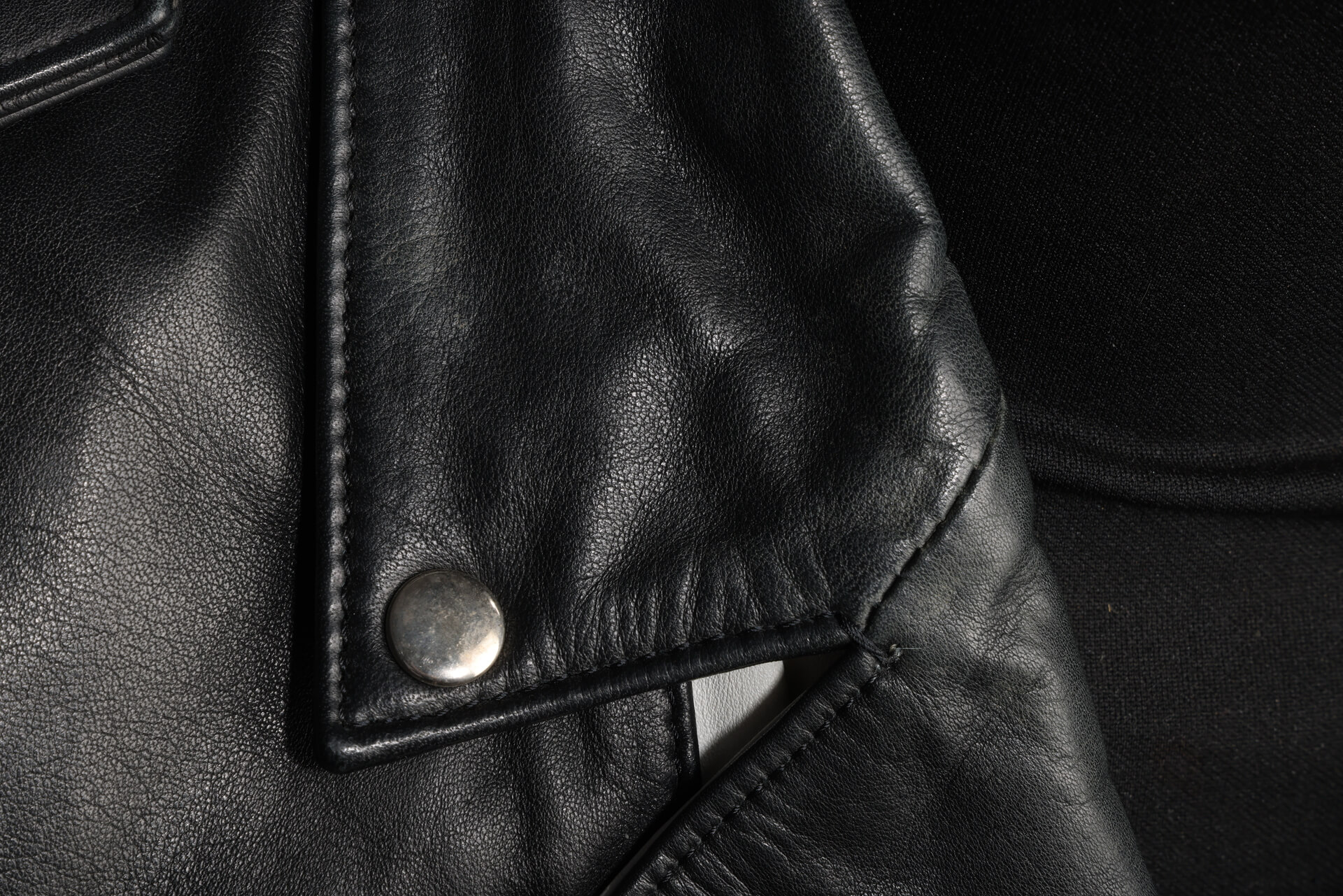 A close-up of the black and white leather jacket