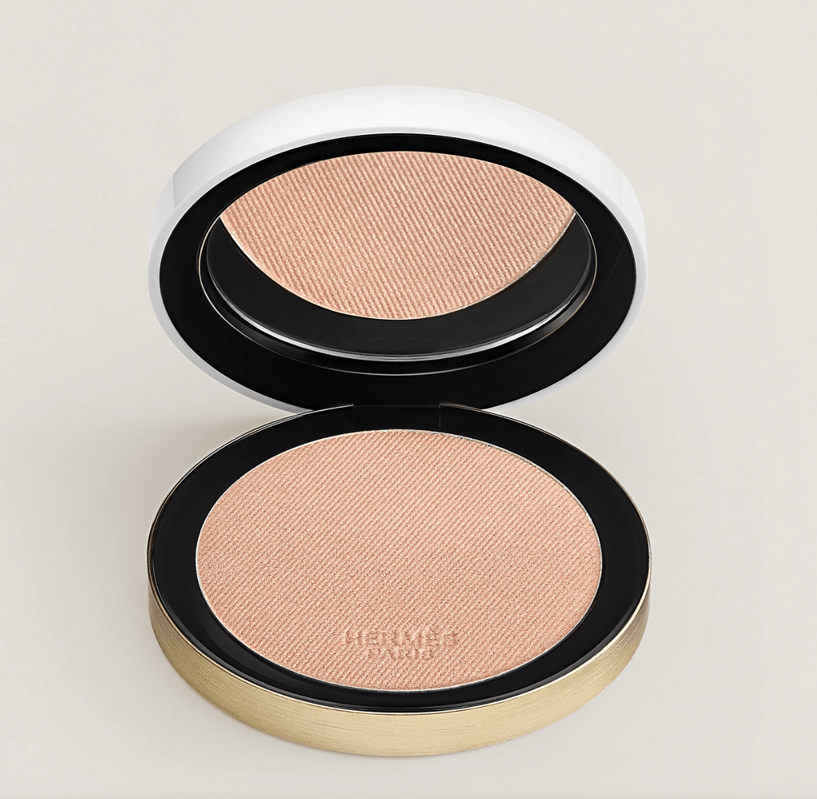 Hermès’ glow powder Mirage completes a perfect holiday makeup look