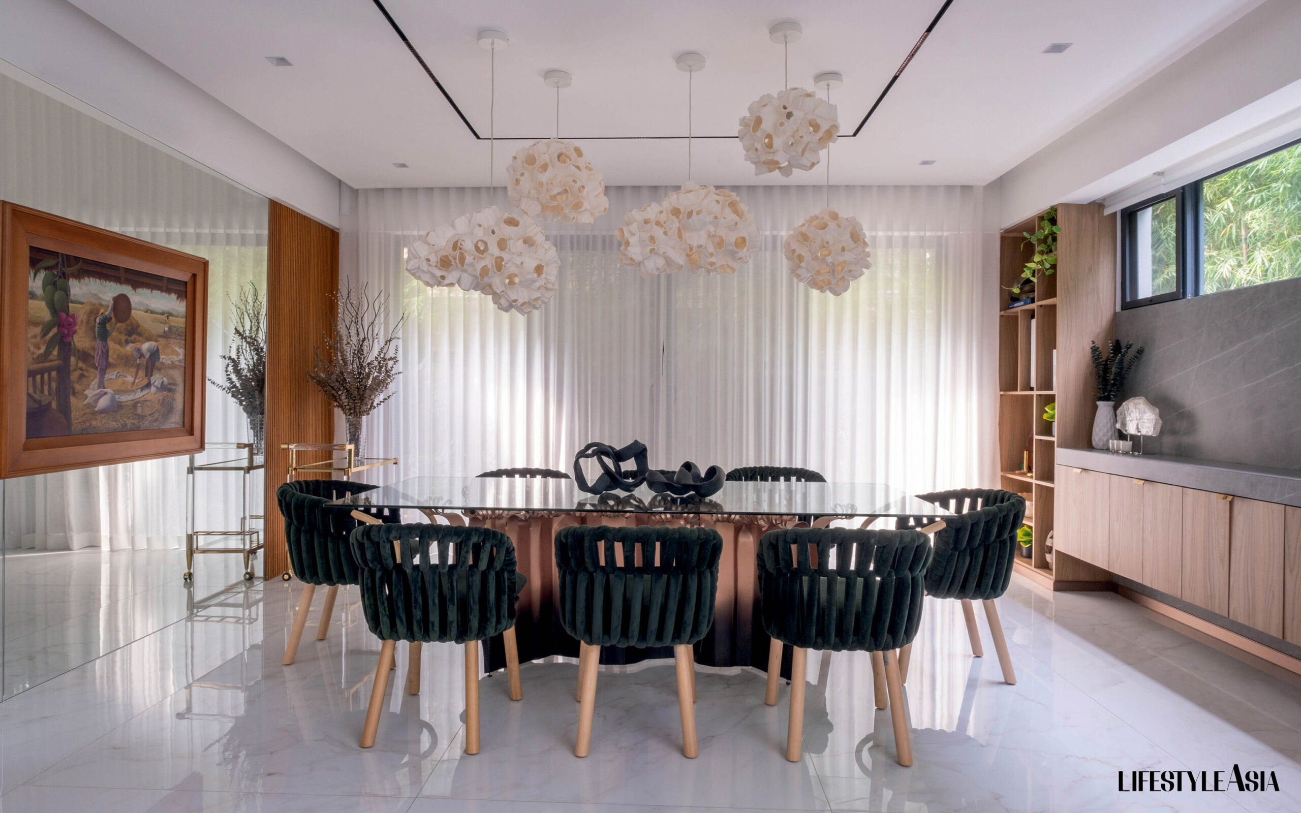 Dining space with all the furniture and lights by Kenneth Cobonpue