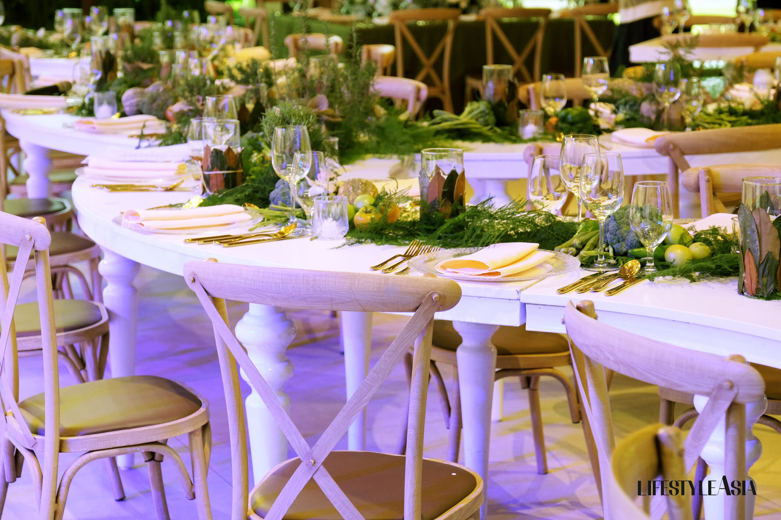 Sophisticated, curved tables were laden with fresh produce