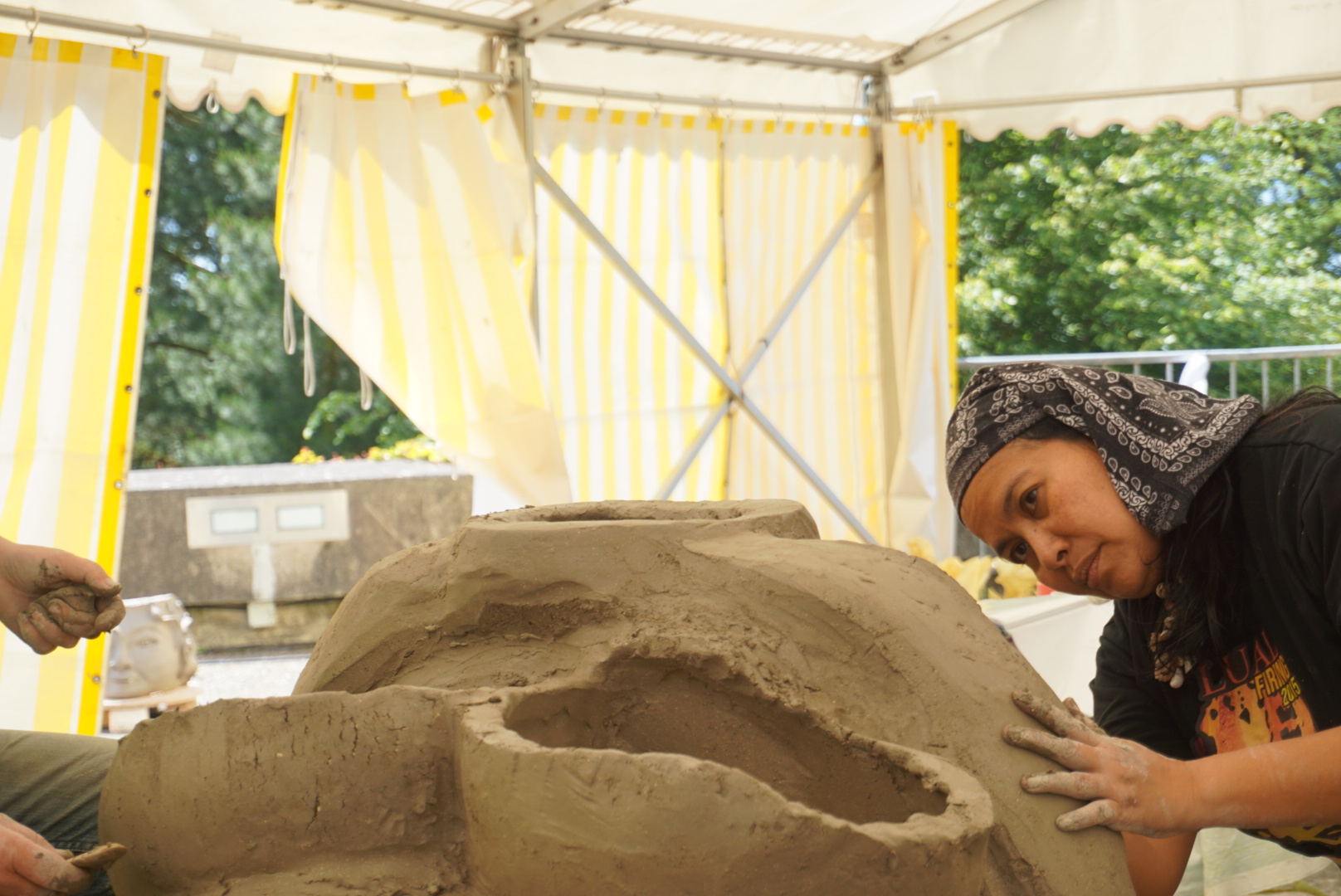 Rita Badilla-Gudiño working on a sculpture