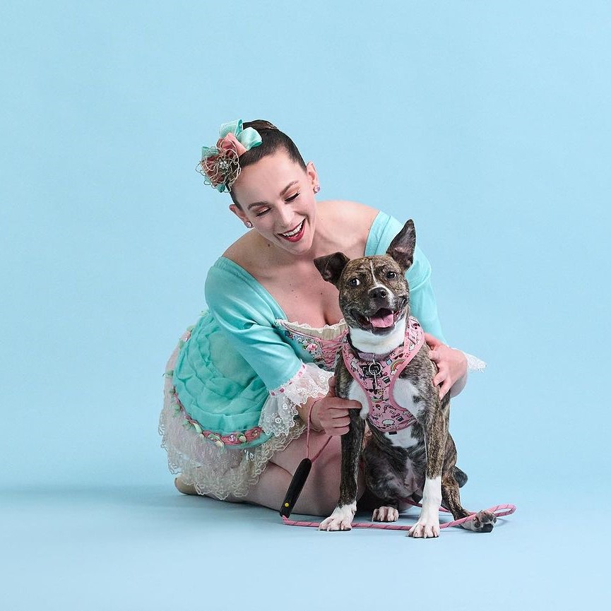 Amy Herchenroether of Saint Louis Ballet as a Marzipan shepherdess posing with shelter dog Eureka Springs