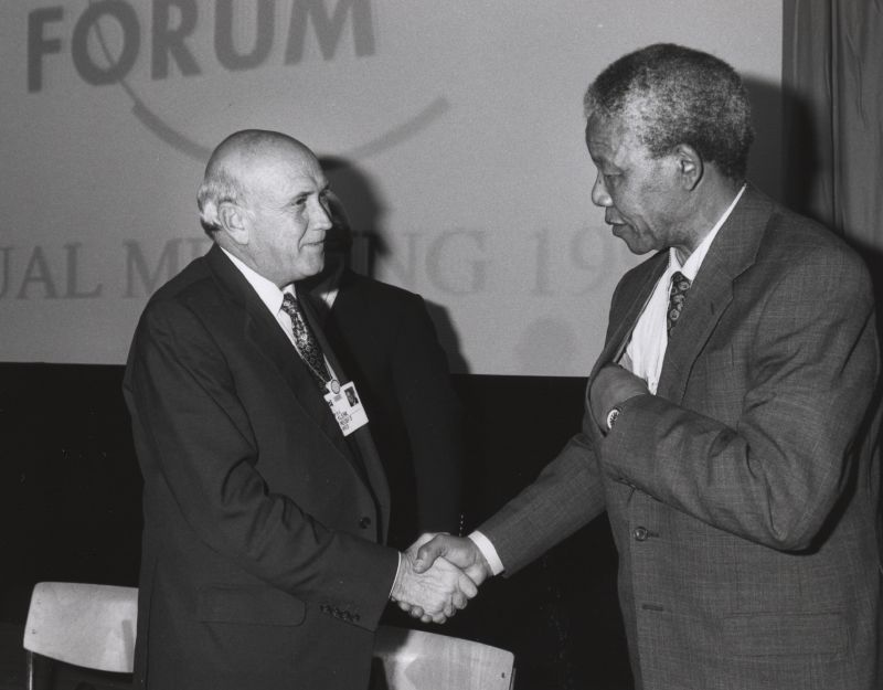 Frederik de Klerk and Nelson Mandela shake hands at the Annual Meeting of the World Economic Forum held in Davos in January 1992