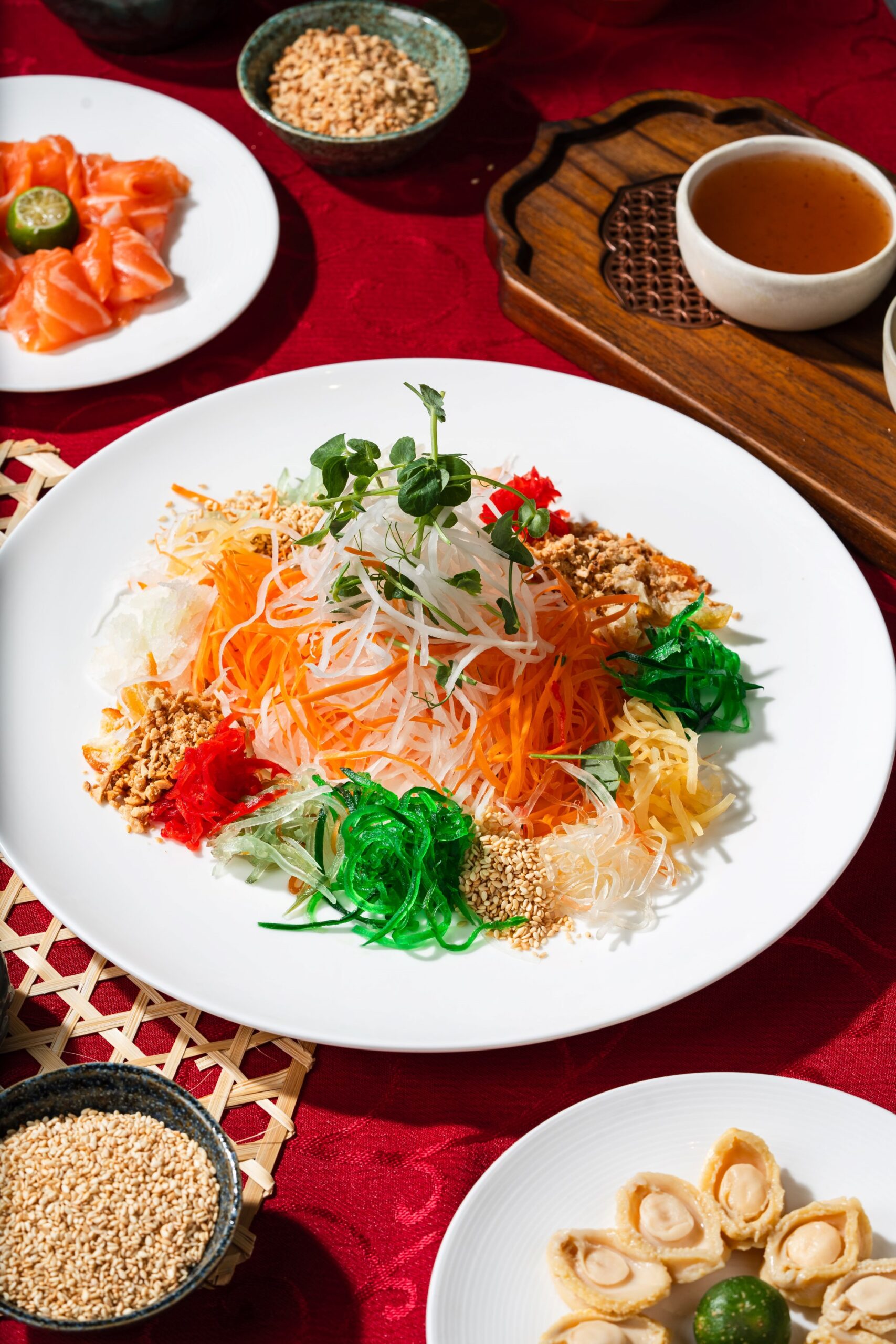 "Yee Sang" or "yu sheng" should be mixed and tossed together as it is believed to bring good fortune