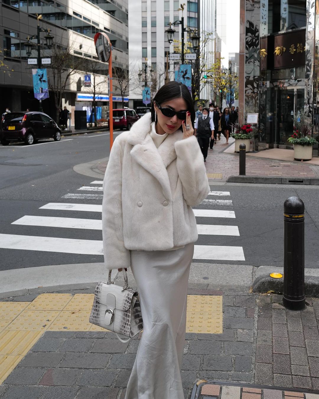 Heart Evangelista sporting all white in the streets of Tokyo