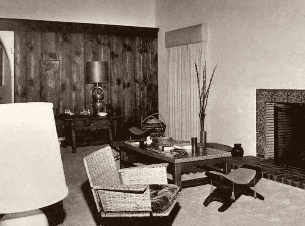 An old photo of the living room adjacent to the dining room