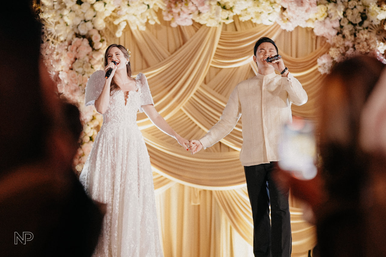Peps Bengzon and Sara Appleton performed for guests at their Manila wedding