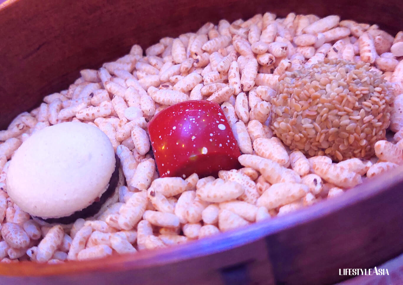 The "surprise" bento with (L-R) a red bean macaron, ichigo chocolate, and red bean mochi with sesame