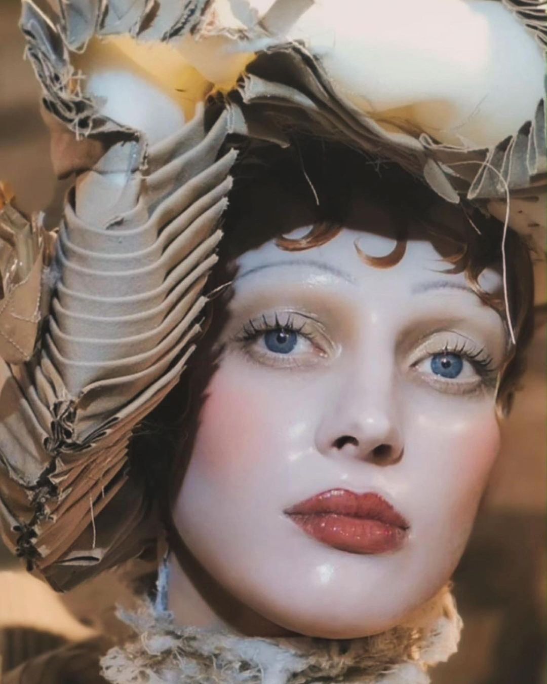 A model highlighting Pat McGrath’s glass skin makeup technique