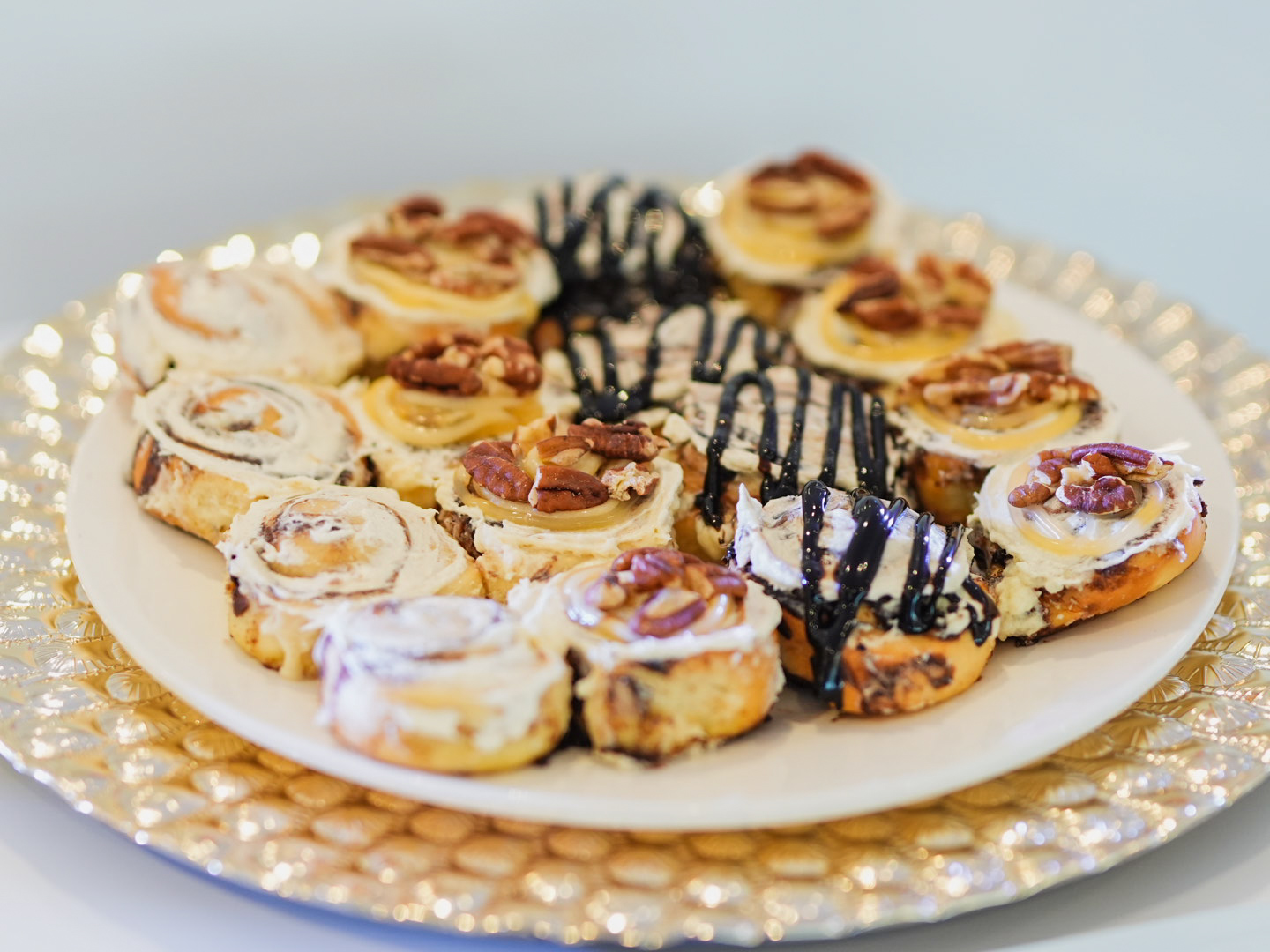 LEFT: Kevin Ong Patisserie’s Noissette hazelnut dessert; RIGHT: Cinnabon classic swirls