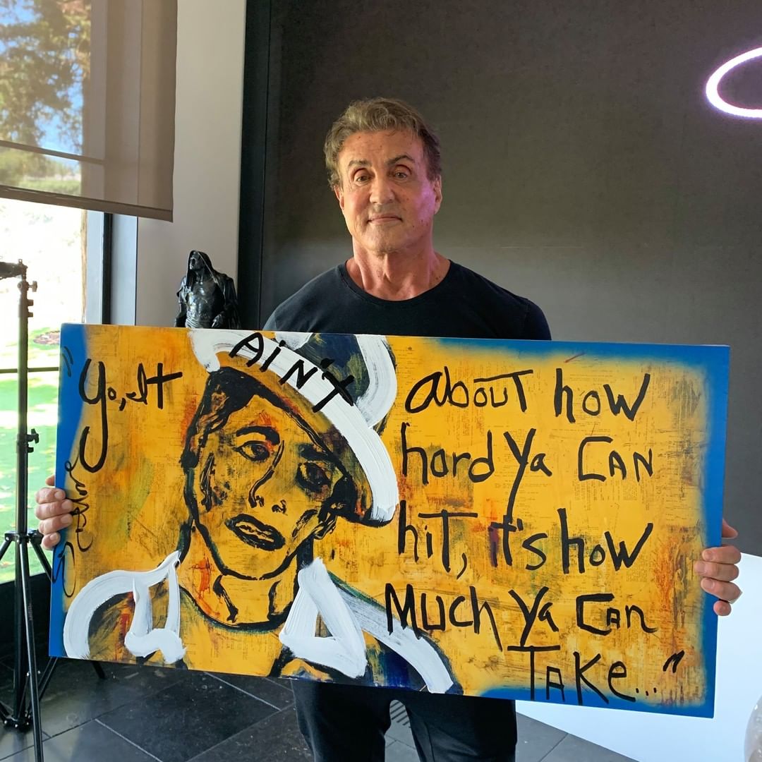 Sylvester Stallone with his work “The Bum I”/Photo via Instagram @stalloneartwork