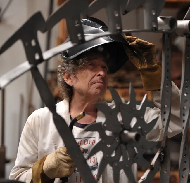Bob Dylan working on his ironwork sculpture/Photo from the Bob Dylan website 