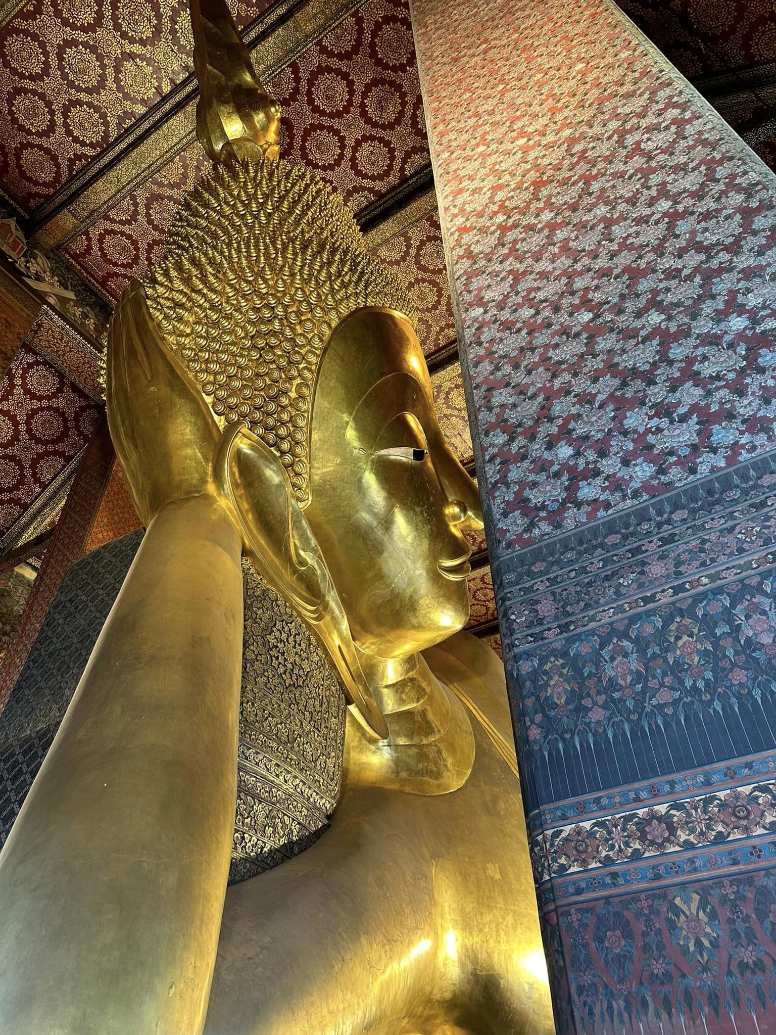 Wat Pho’s gold plated, largest Reclining Buddha measures 15 meters high and 46 meters long