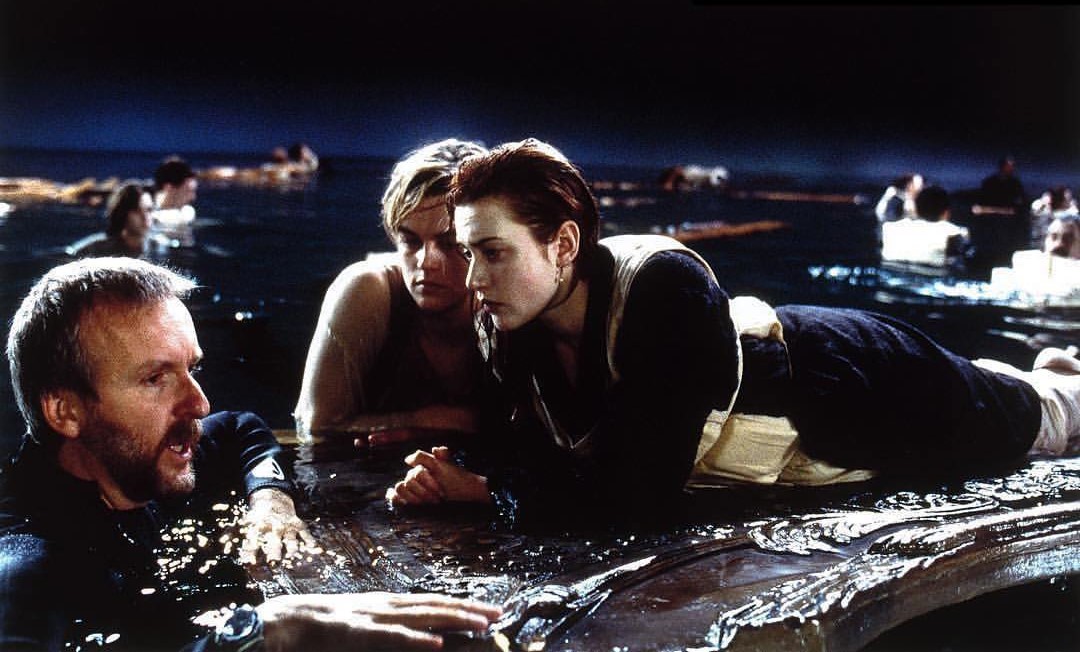 James Cameron, Leonardo DiCaprio, and Kate Winslet behind the scenes of Titanic's finale