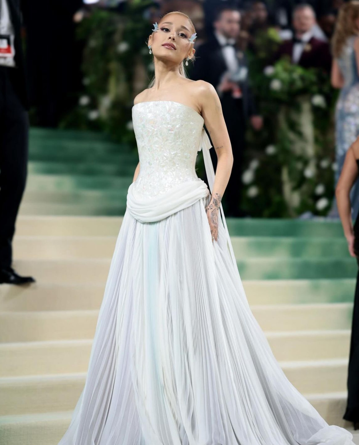 Ariana Grande looked stunning in a pearly white gown at the 2024 Met Gala. 