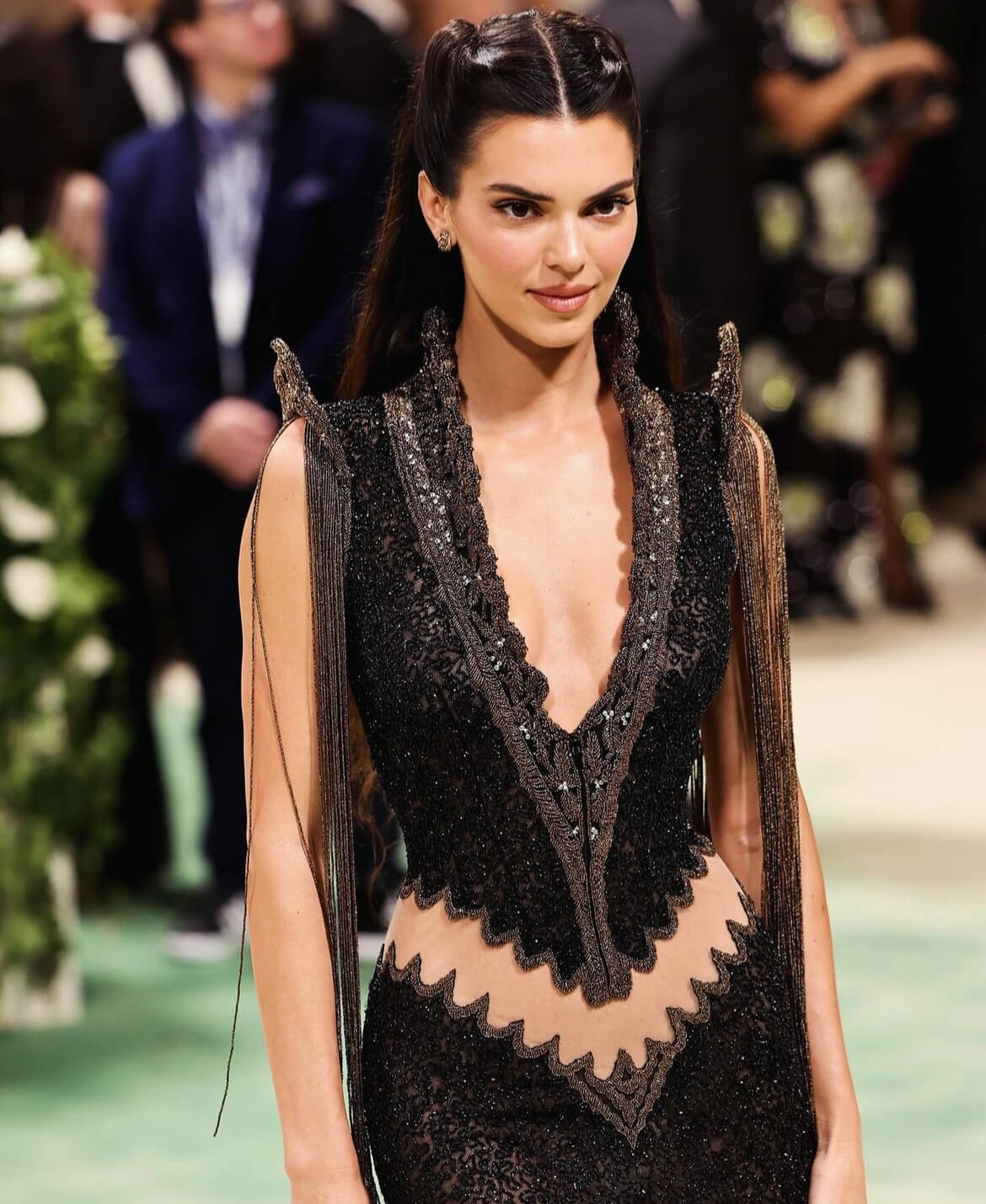 Jenner expressed her excitement about wearing McQueen's creation, telling Vogue about its unique features, including a scalloped butt cutout, a high-neckline, and intricate beaded details. 