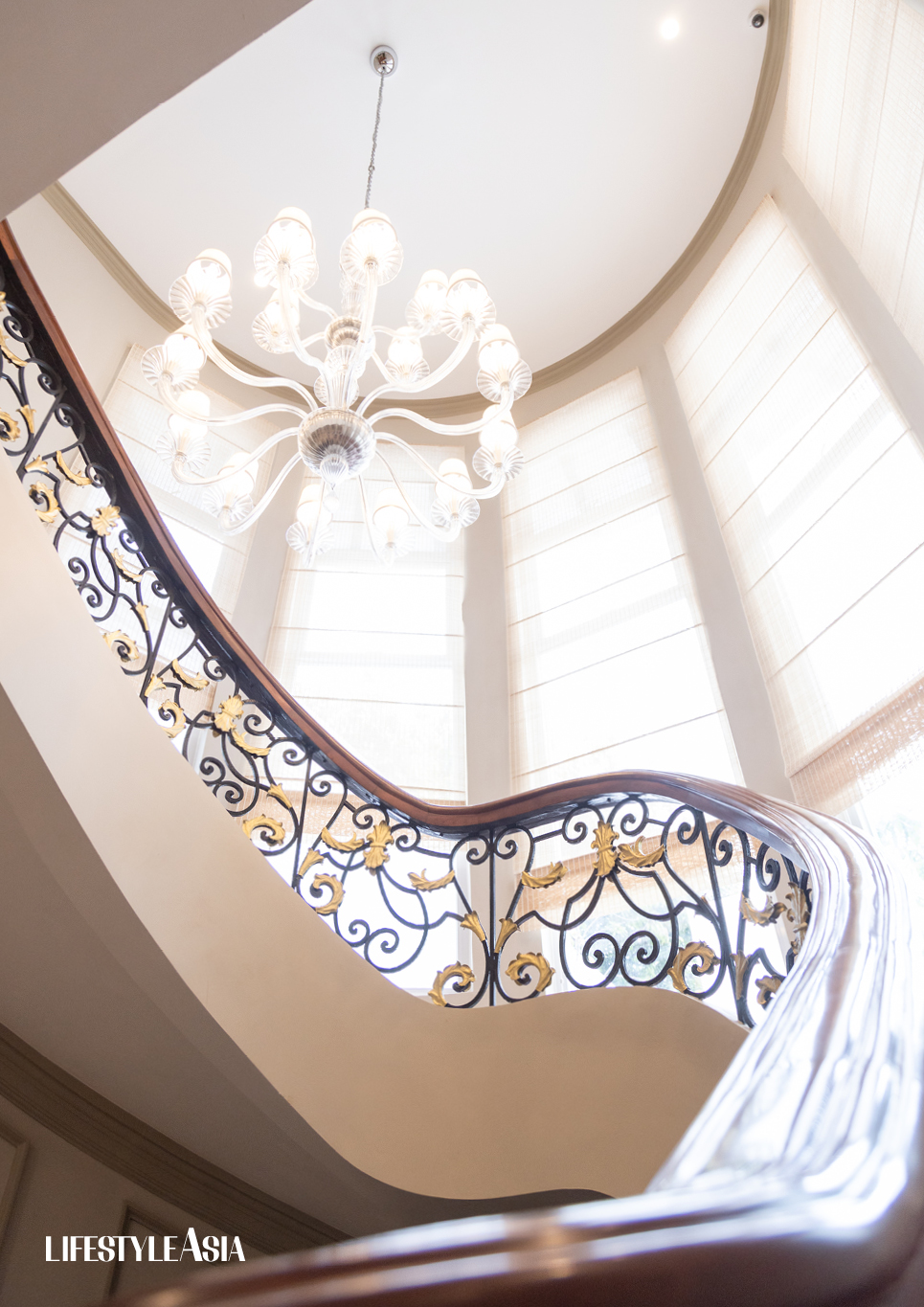 The elegant, winding stairway of the Laperal Mansion