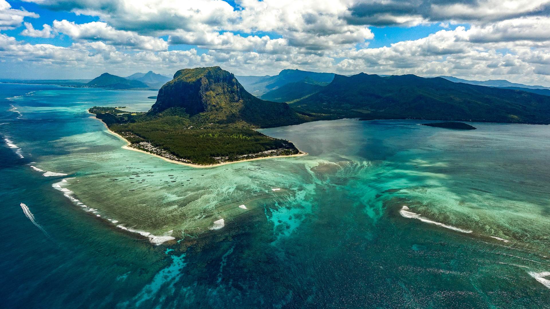 Tourists will see Mauritius’ underwater waterfall through a helicopter flight activity/Photo from Xavier Coiffic via Unsplash