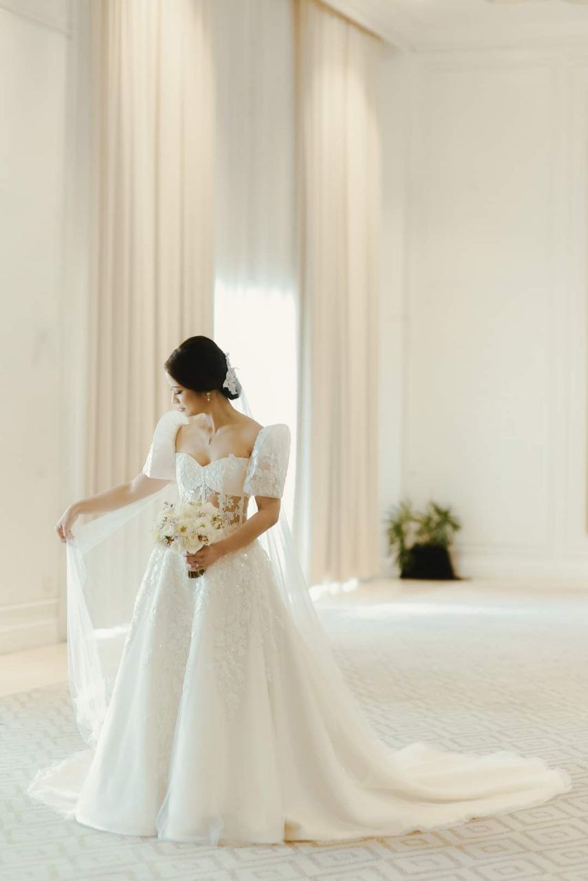 An A-Line Terno bridal gown made of layers of soft French Tulle